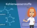 Chemische Strukturen von Kohlenwasserstoffen: eine azyklische und eine zyklische Verbindung. Eine lächelnde Frau mit roten Haaren gibt Daumen hoch.
