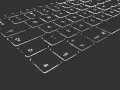 Nahaufnahme einer beleuchteten Tastatur. Die Tasten sind mit weißen Symbolen und Buchstaben versehen, die im Dunkeln leuchten. Die "Umschalt"-Taste ist deutlich zu erkennen.