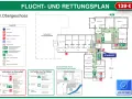 Flucht- und Rettungsplan mit Symbolen für Feuerlöscher, Rettungswege und Notausgänge. Ein Hinweis auf die Gefahren von Flusssäure ist nicht ersichtlich.