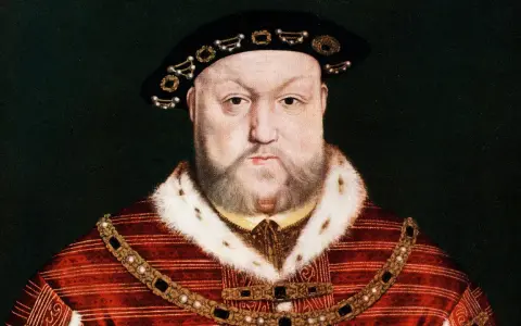 Porträt von Heinrich VIII. in prächtiger Kleidung. Seine vielen Ehepartnerinnen kannten seine Macht.